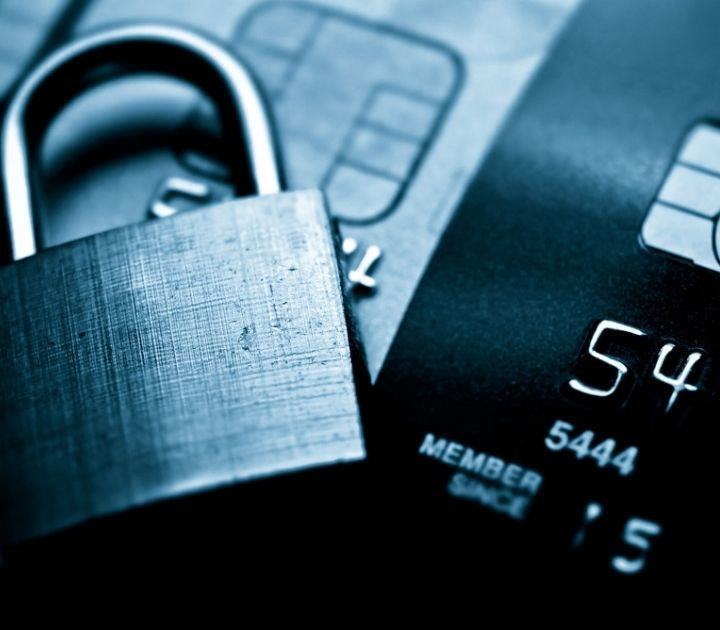 Metal lock and credit card symbolizing secure payment