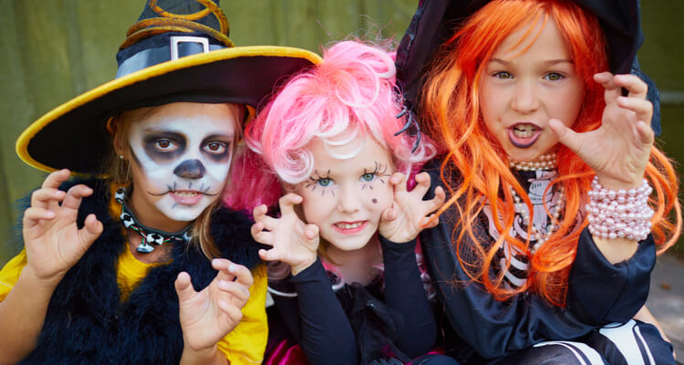 A group of children in Halloween costumes